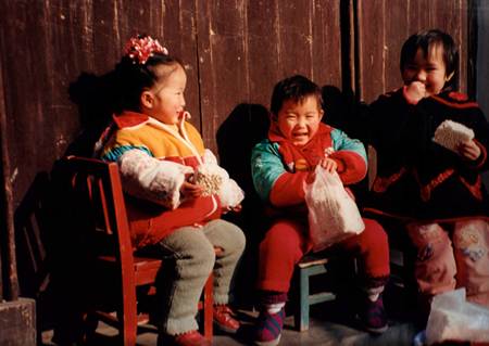 LAWRRENCE SMITH, "Children of Tongli, China", 1999.   Colour print mounted on card, signed on reverse